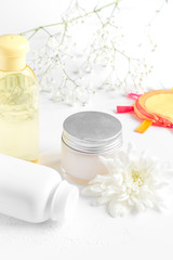 natural organic cosmetics with herbs for baby on white background