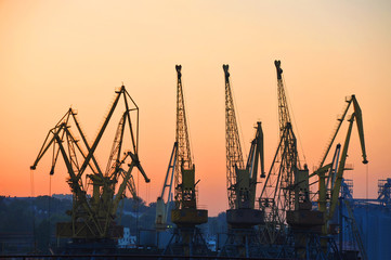 Obraz premium Port cargo crane at sunset