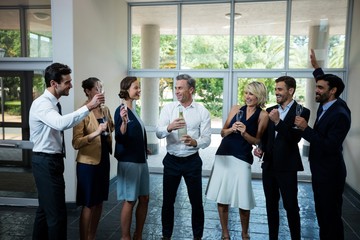 Business executives celebrating at conference center