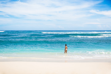 Fototapeta na wymiar Tropical beach, ocean. Woman on the beach background. Vacation at Paradise. Ocean beach relax, travel.