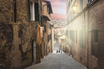 Alleys on a rainy spring day in a small magical village Siena, T