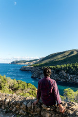 Young girl looking on the sea