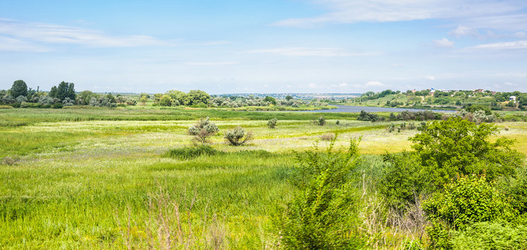 The nature of the banks of the Dead Donets river in Don river delta in the vicinity of Rostov-on-don. Summer steppe landscape. The view from the train window