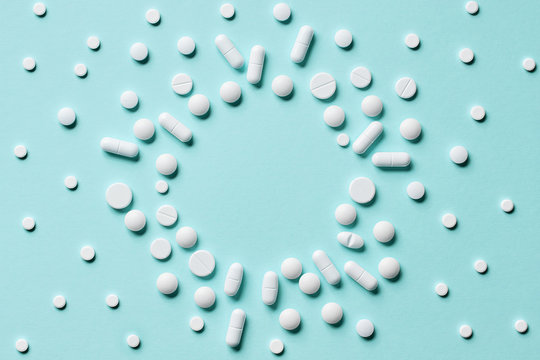 white pills on blue background
