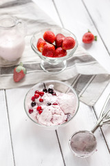 organic homemade ice cream in glass bowl on wooden background