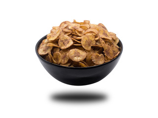 Sweet bananas chip in black bowl isolated on white background. S