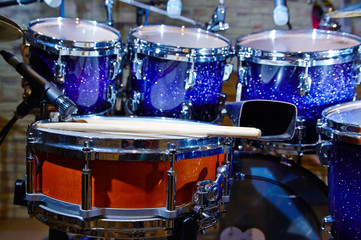 Drums set and sticks, close-up, selective focus