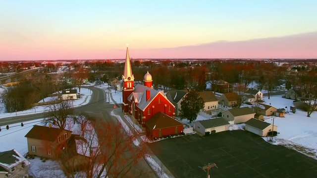 Beautiful Church steeples catch first light of Daybreak in small town America.
