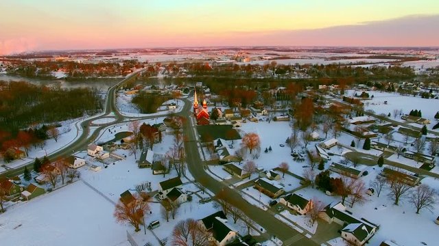 Beautiful Church steeples catch first light of Daybreak in small town America.
