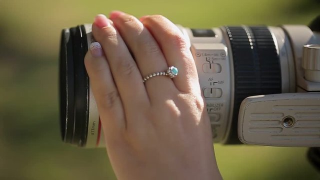 Young woman photographer at work