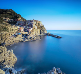 Manarola village, rocks and sea. Cinque Terre, Italy.