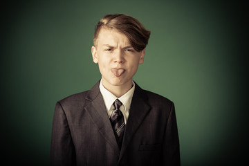 Rude handsome young teenage boy