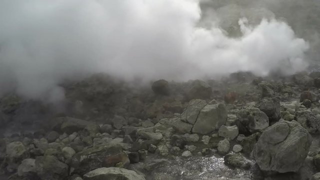 Kamchatka Peninsula, geothermal field of Dachnye Hot Springs: activity of natural volcanic hot springs is emission clouds of hot gas, steam from fumaroles.