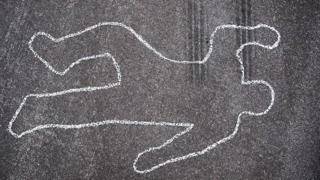 A police chalk line of a pedestrian who was hit by a car becomes a crime scene.