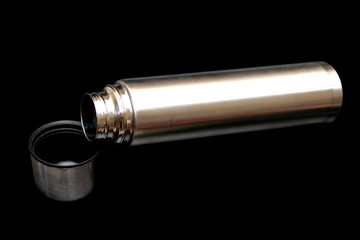 Keep bottled water in stainless isolated on black background.