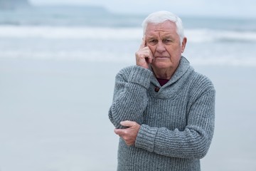 Portrait of senior man standing on the beach
