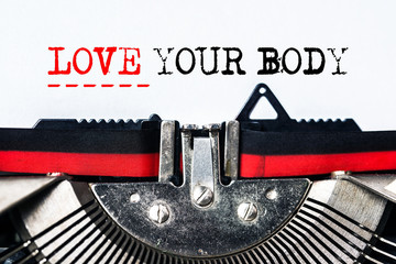 love your body typed on white paper with old typewriter