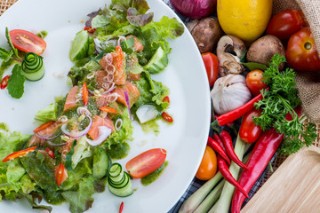 Fresh Salmon Salad with vegetables,healthy salad with mixed lett