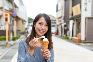 Woman eating ice cream in kanazawa