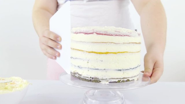 Removing excess cream coating from rainbow cake 4K