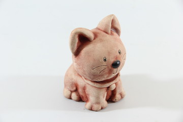 cat ceramic doll in garden isolated on a white background.