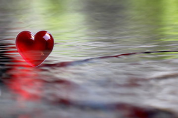 Red Heart with soft focus water reflections