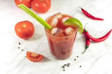 Bloody Mary cocktail with lime, celery and chilis