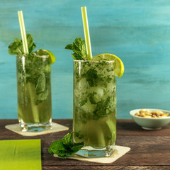 Mojito cocktail with mint leaves and lime