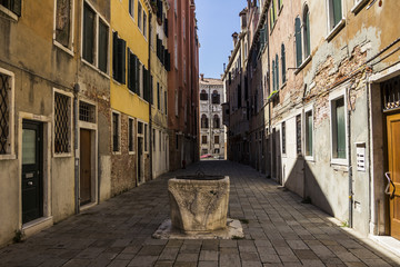 medieval architecture, houses, bridges, squares and boats on the canal-streets of Venice, Italy