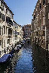 Fototapeta na wymiar medieval architecture, houses, bridges, squares and boats on the canal-streets of Venice, Italy