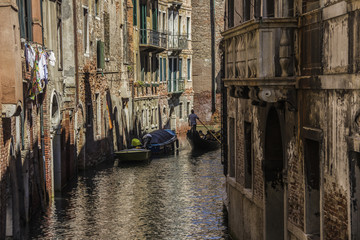 Obraz na płótnie Canvas medieval architecture, houses, bridges, squares and boats on the canal-streets of Venice, Italy