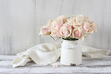Pink roses in vintage vase