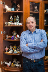 the collector and his hippos in a private collection