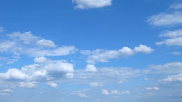 White clouds in the blue sky. Timelaps