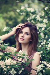 Young Woman Fashion Model with Spring Flowers