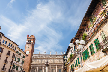 Obraz premium Sunny view of the Piazza delle Erbe, palazzo Maffei and Gardello tower at historical center of Verona, Veneto region, Italy.