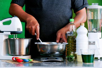 Men baker working in the bakery