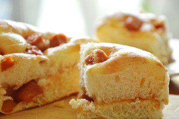 bread topping slice pork sausage cut for piece on wooden chop block