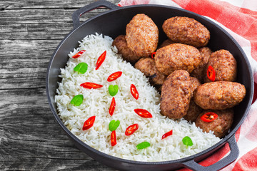 rice and juicy delicious meat cutlets, view from above