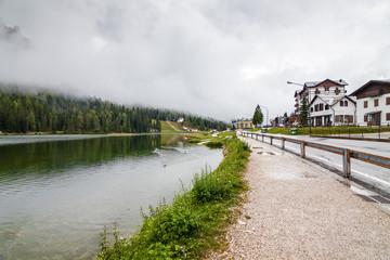 Fototapeta na wymiar Cloudy view of Misurina lake in Dolomite Alps, Veneto region, Italy.