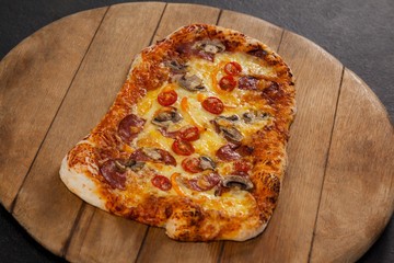 Delicious italian pizza served on wooden board