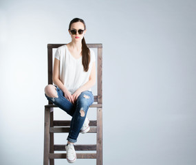 Portrait of attractive young woman sitting.