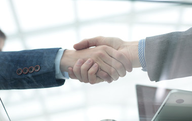 businessman shaking hands to seal a deal with his partner