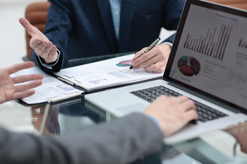 Fototapeta premium Group of business people busy discussing financial matter during