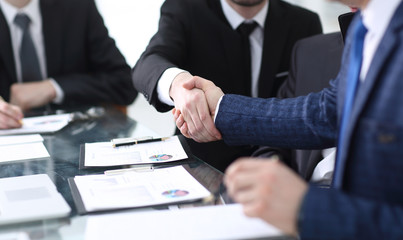 businessman shaking hands to seal a deal with his partner