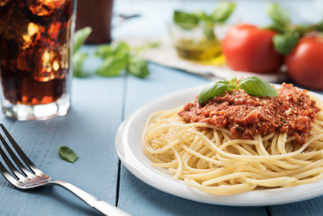 Traditional Italian spaghetti bolognese on wooden background
