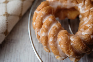 Sweet donuts with icing on wooden background