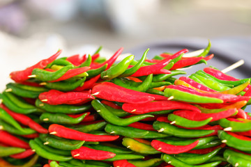 Red and green chili peppers at the background
