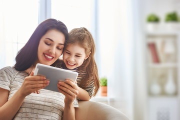 mom and child with tablet