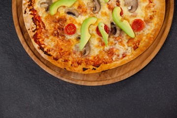 Delicious italian pizza served on pizza tray